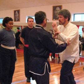 Sifu Dale explaining push hand rules at a Peaceful Dragon Team Tournament